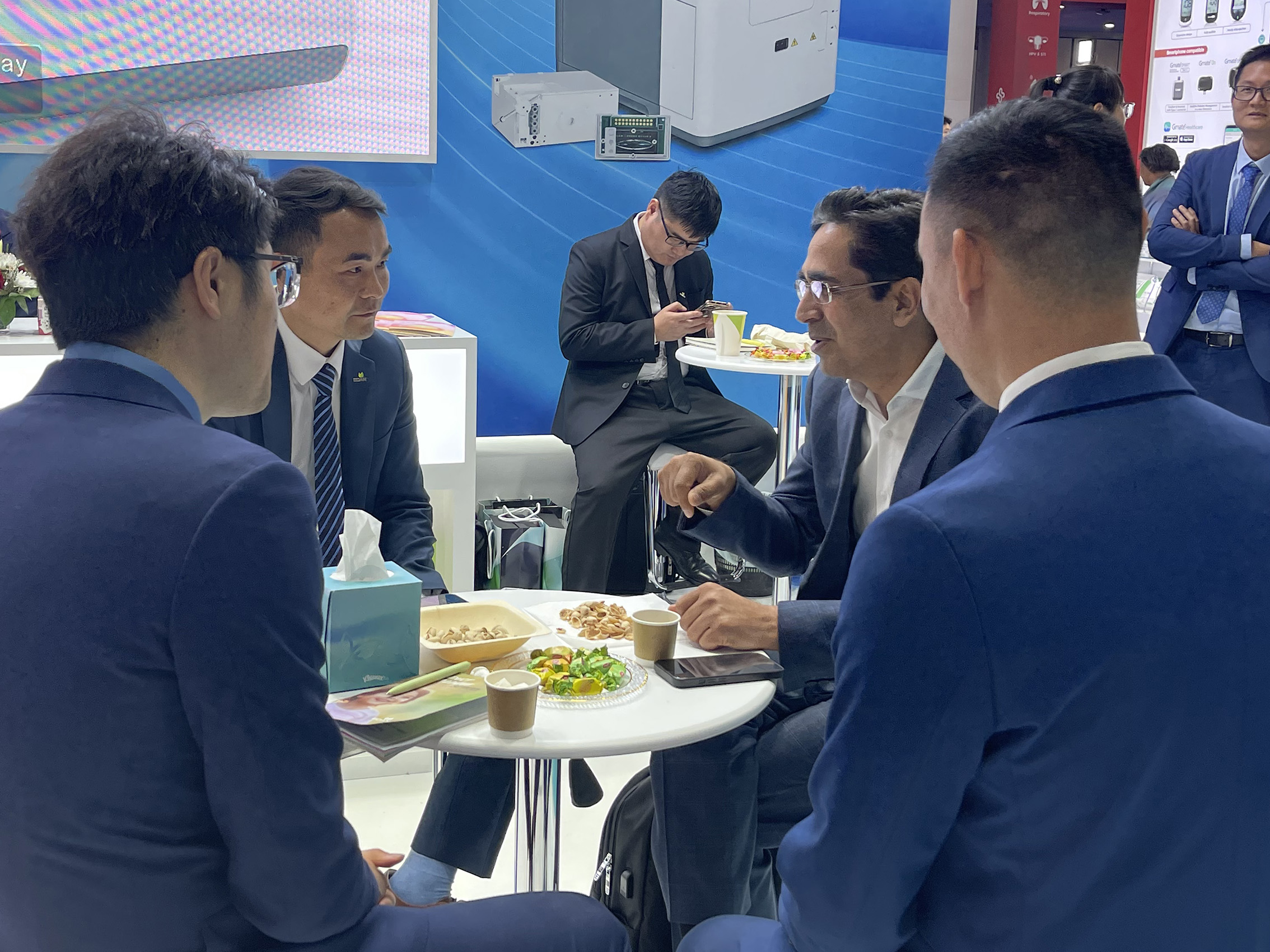 victor xiao exchanging insights with clients @ medlab me.jpg